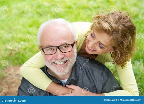a happy older hispanic couple having a good time at home elderly retirement and the concept of