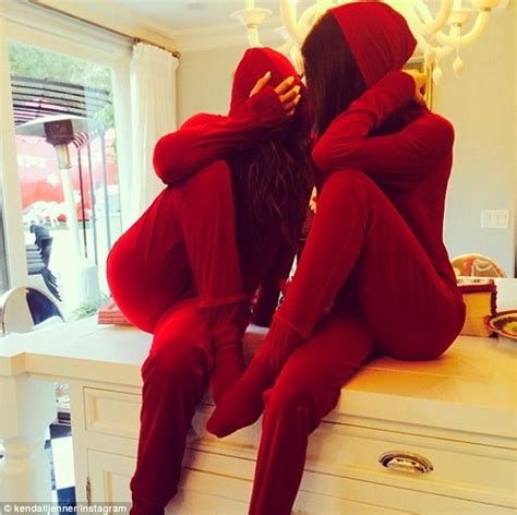 Khloe Kardashian And Kendall Jenner Snuggle Up In Red Onesies Daily