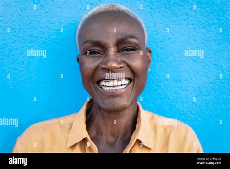 happy african woman portrait afro senior female having fun smiling while posing in front of