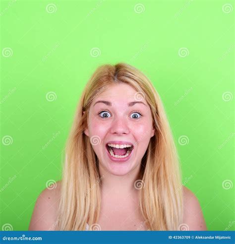 Portrait Of Girl With Funny Face Against Green Background Stock Image