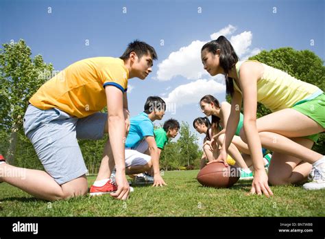 Group Of Friends Playing American Football Stock Photo Alamy