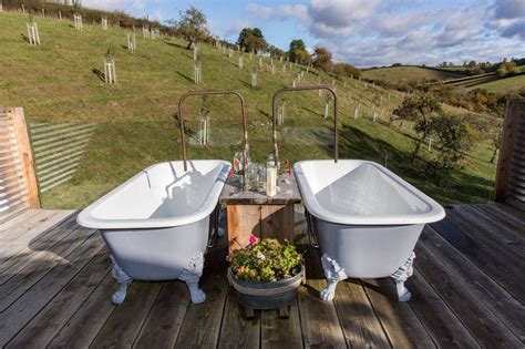 Outdoor Twin Rolltop Baths Await Outside This Open Plan Cottage On An