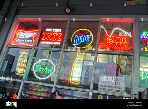 Neon Beer Signs In Retail Liquor Store Window Stock Photo Alamy