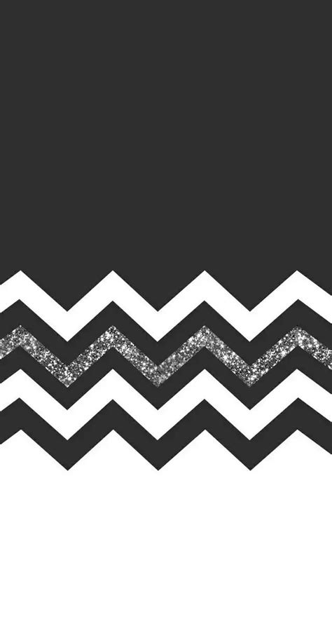 A Black And White Chevron Pattern With Silver Glitter