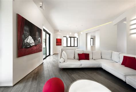 You can create specific accent walls and complement them with faux textures and solid patterns. Red & White Apartment