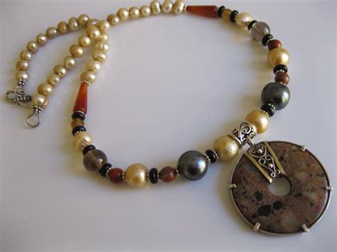 A Gold Pearl Necklace With Mixed Jasper Donut Pendant By Julleen Gold