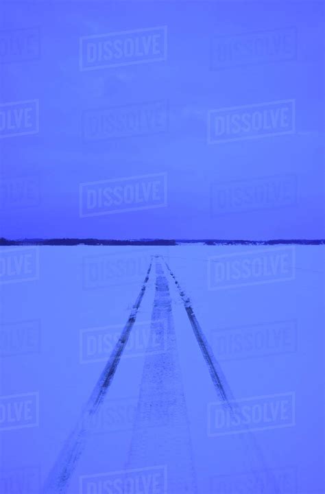 Snowmobile Tracks On Frozen Lake Stock Photo Dissolve