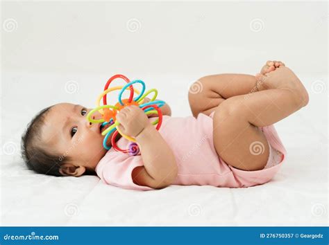 Infant Baby Biting Colorful Rubber Bites Toy On Bed Stock Image Image