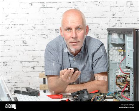 A Technician Repairing A Computer With Different Tools Stock Photo Alamy
