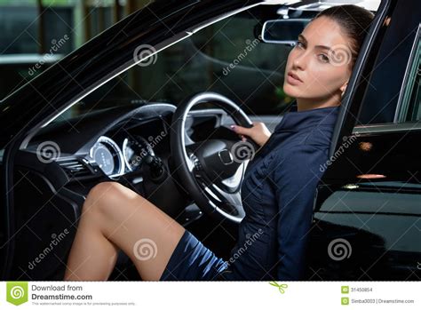 One of the most physically attractive features of a woman is her curves. Sensual Woman Driver Sitting Inside Her Car Relaxed Stock ...