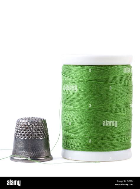 Single Spool With Green Thread And Thimble Stock Photo Alamy