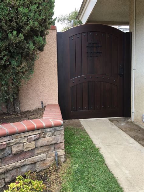 Custom Wood Gate By Garden Passages With Decorative Metal Grill And