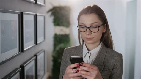 businesswoman standing using mobile phone stock footage sbv 320581984 storyblocks