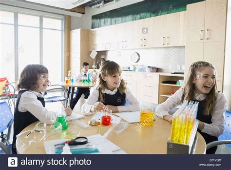 School Girls Conducting Experiment In Science Classroom Stock Photo Alamy