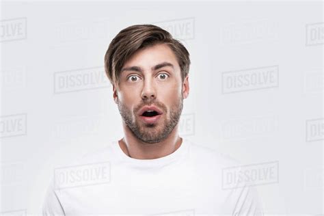 Handsome Shocked Man Looking At Camera Isolated On White Stock Photo
