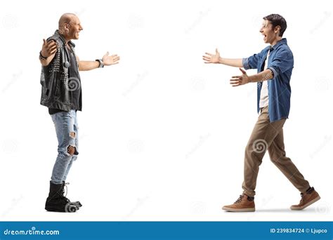 Full Length Profile Shot Of Two Men Walking Towards Each Other With