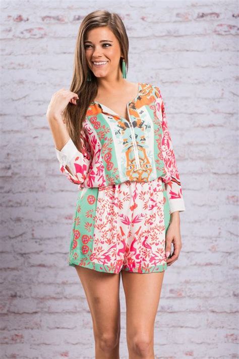 we are getting all sorts of summer vibes from this romper that print is so fun and unique all