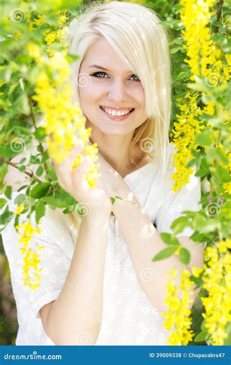 Beautiful Blonde Girl With Yellow Flowers Stock Photo Image Of Energy