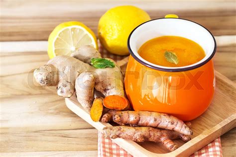 A Cup Of Turmeric Tea With Lemon And Ginger Benefits For Reduce