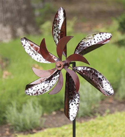 This spinner will add a touch of whimsy to your garden after dark. Metallic Flower Garden Wind Spinner | Wind and Weather