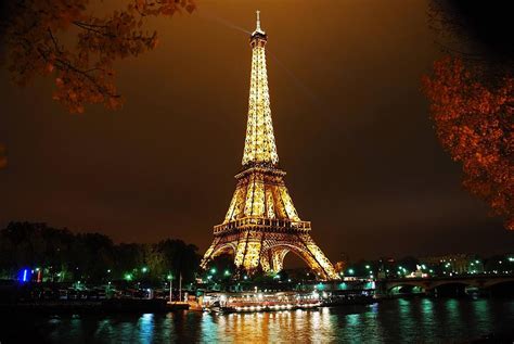 8x12, 12x18, 16x24, 20x30 paris's iconic eiffel tower illuminated at night. Tour Eiffel at Night Photograph by Thomas Sneed