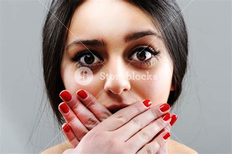 Beautiful Brunette Girl Silent With Hands On Mouth Royalty Free Stock