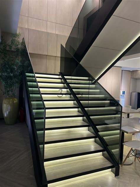 Mild Steel Staircase Structure With Glass Handrail And Titanium Topping