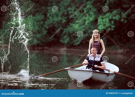Happy Couple Rowing And Splashing On Lake Stock Image Image Of Lake