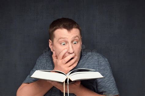 Portrait Of Shocked Man Reading Something Extraordinary In Book Stock Image Image Of