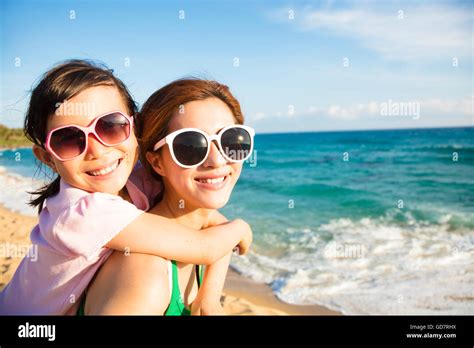 Mother And Daughter Having Fun On The Beach Stock Photo Alamy