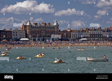 Packed Beach On Weymouth Seafront In Dorset On A Beautiful Sunny Day