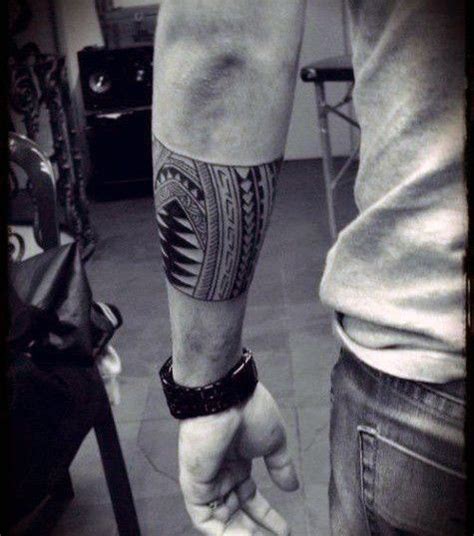 Male With Tattoo On Forearm With Tribal Design Tattoo Band