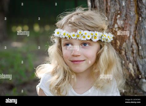 Adorable Smiling Little Blond Girl With Daisy Flower Headband Stock