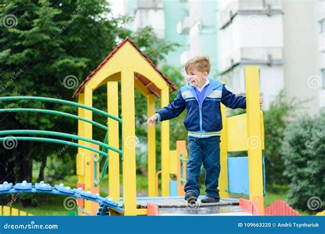 Funny Children Play On A Children`s Playground Stock Photo Image Of