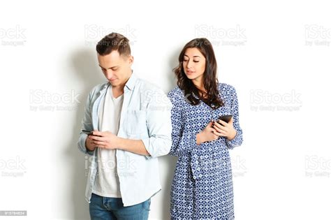 Jealous Wife Spying Her Husband Mobile Phone While He Is Reading A Message Technology