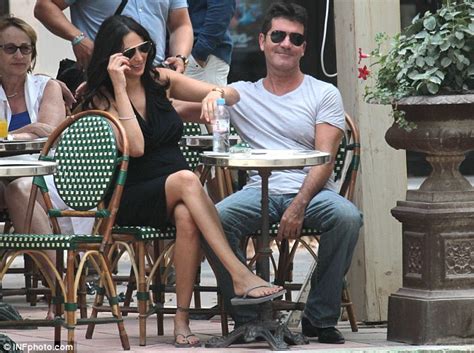 Simon Cowell Kisses Pregnant Lover Lauren Silverman As They Take Stroll