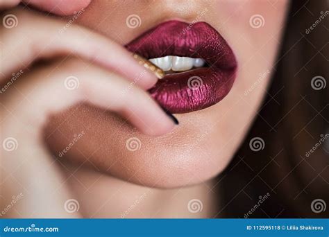 close up of beautiful woman lips with lipstick open mouth cosmetology fashion makeup concept