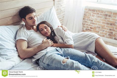 Couple in bedroom stock image. Image of home, bedroom - 107379839