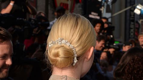 Elle Fanning Dresses Up A Bun Hairstyle With A Crystal Hair Accessory Glamour