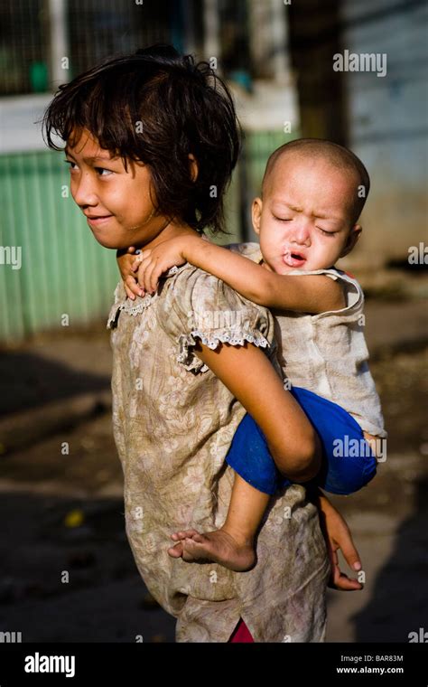 Child Carrying Baby Stock Photo Alamy