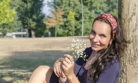 Portrait Of Beautiful Young Woman With Flowers Girl On Nature Spring
