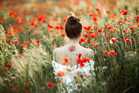Free Woman Stands With Naked Back There Is A Tattoo Flower Poppy Among The Poppies Field Free