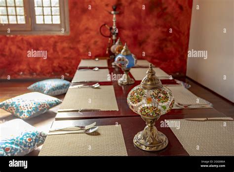 Traditional Middle Eastern Dining Setting With Woven Mats On Tables And