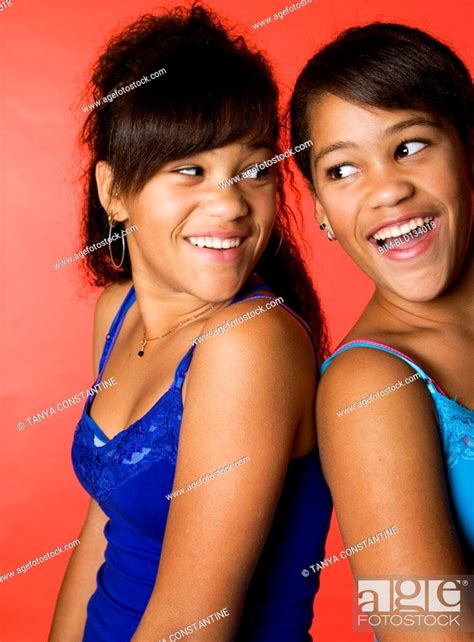 Mixed Race Teenage Twin Girls Smiling Stock Photo Picture And Royalty