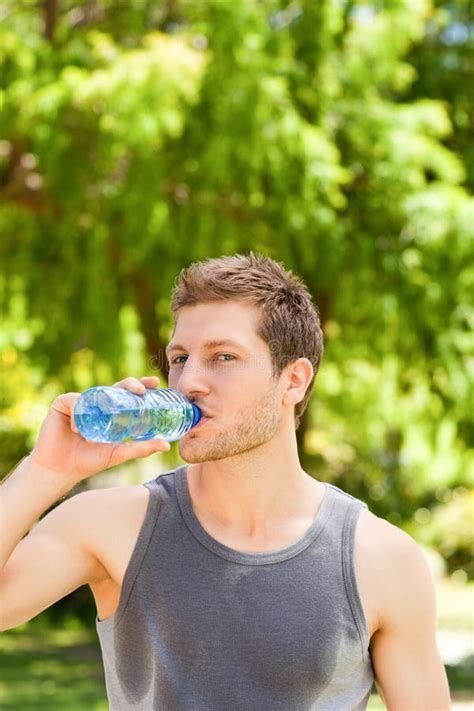 Sporty Man Drinking Water In The Park Stock Image Image Of Endurance