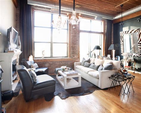 This expansive finished basement features lightly colored carpeting and recessed lighting throughout. Loft Style Basement Design Ideas & Remodel Pictures | Houzz