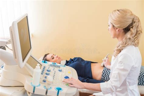 Ultrasound Test Pregnancy Gynecologist Checking Fetal Life With Scanner Exam Stock Image