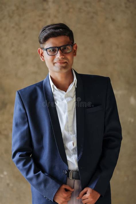 Portrait Of A Young Indian Successful Businessman Wearing Suit And