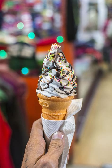 Person Holding Wafer Cone Soft Served Ice Cream Topped Sprinkles