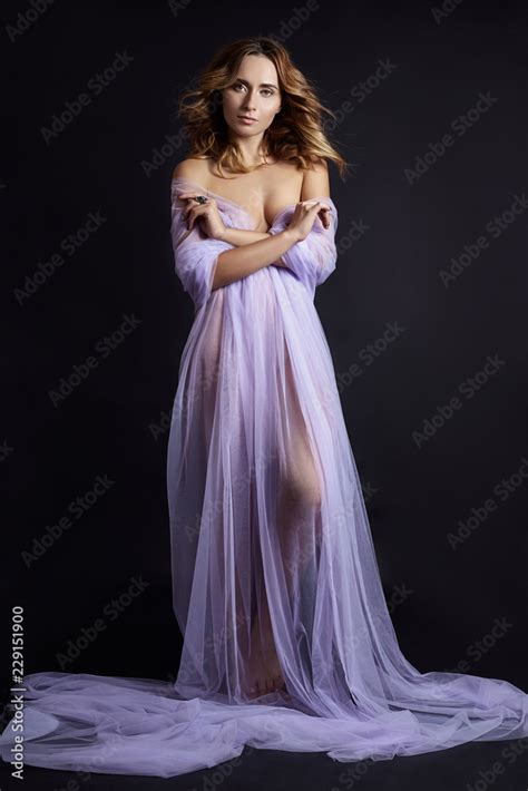 Naked Woman Art In Lilac Light Transparent Dress Posing On A Dark Background Woman Wrapped In